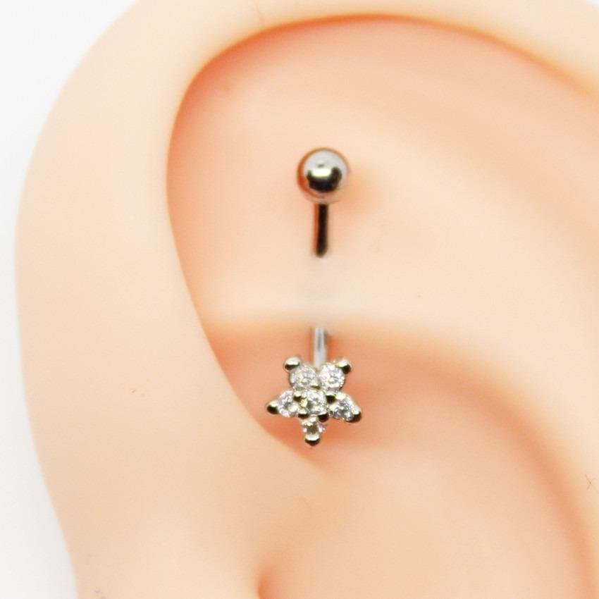 Piercing Rook Banana Flor Cravejada